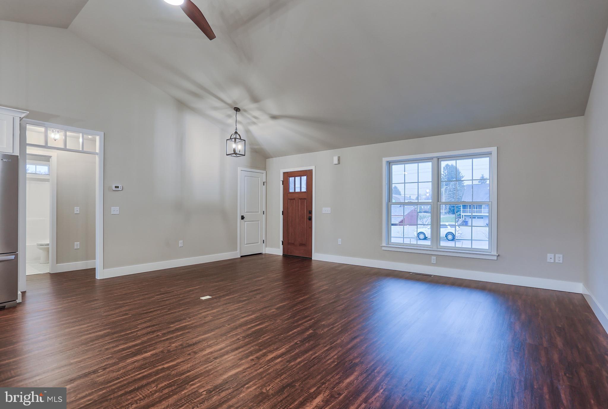 16 Rolling Meadow Road Lebanon, PA 17046 - Photo 3 of 21 a view of an empty room with wooden floor and a window