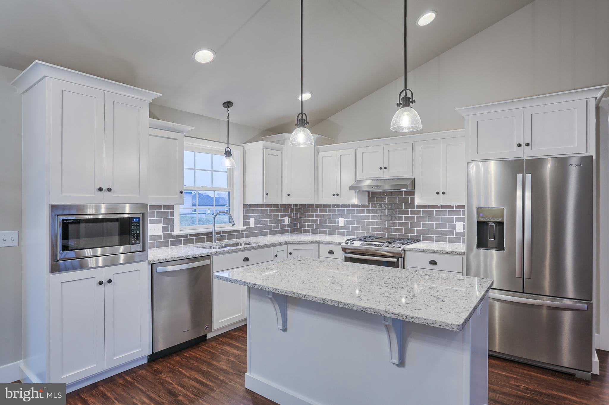 16 Rolling Meadow Road Lebanon, PA 17046 - Photo 6 of 21 a kitchen with stainless steel appliances granite countertop a sink a stove a refrigerator a center island and cabinets