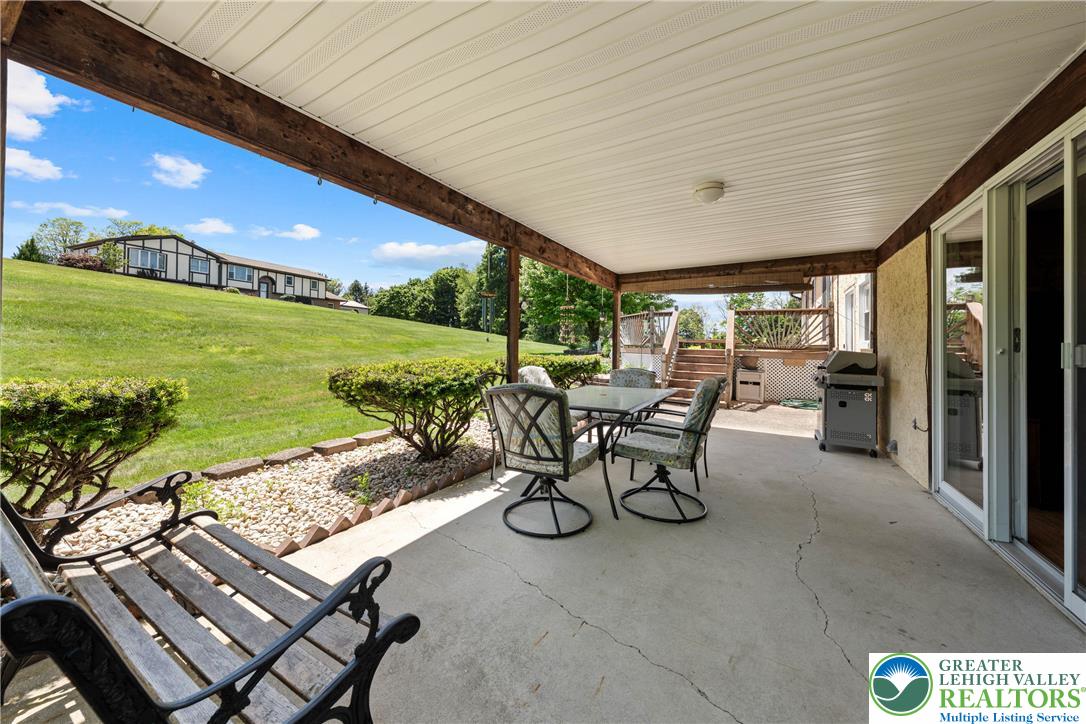 947 Tamenend Road Bath, PA 18014 - Photo 41 of 61 A spacious covered patio offers ample outdoor living space, perfect for al fresco dining.