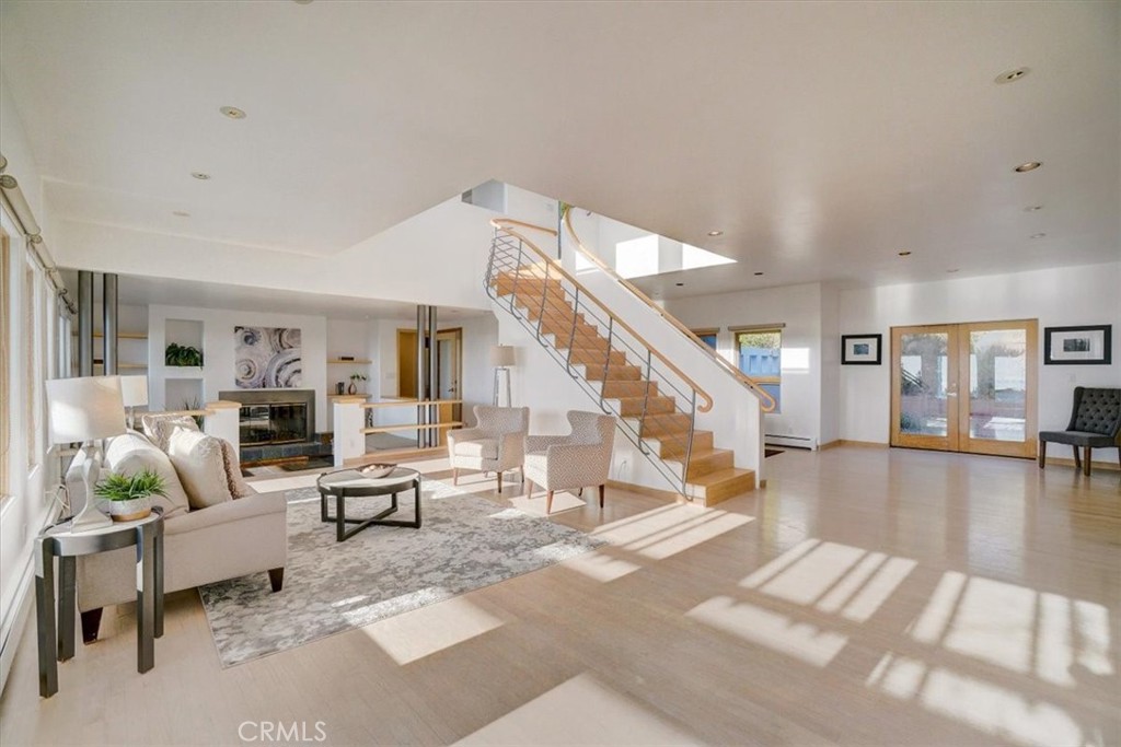 95 Hiller Drive Oakland, CA 94618 - Photo 19 of 58 View from kitchen to living room and sunken living room w/fireplace