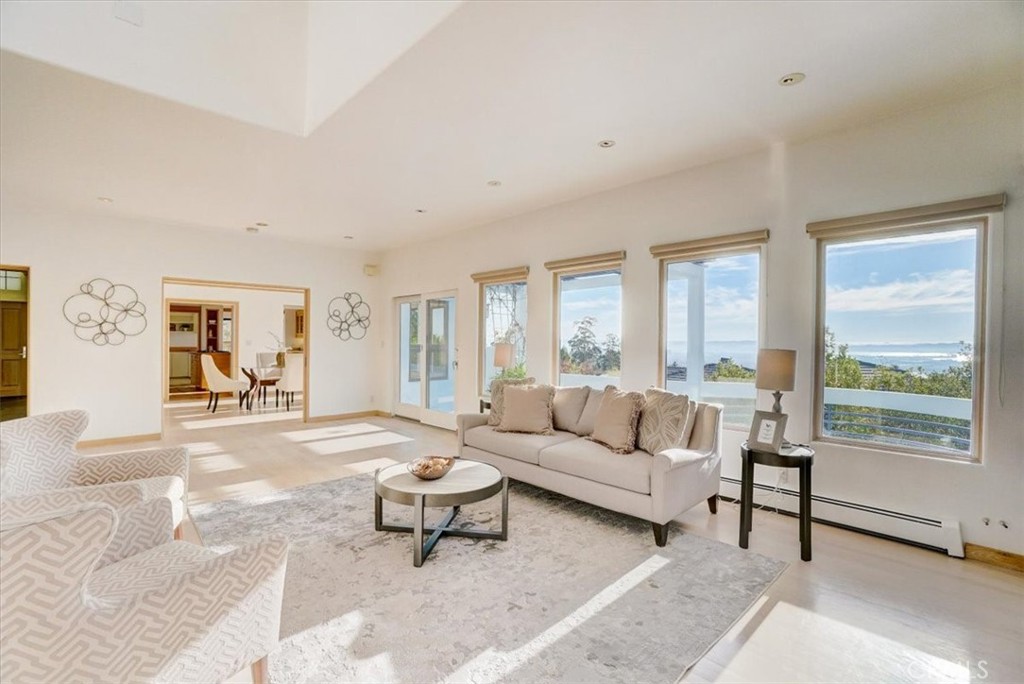 95 Hiller Drive Oakland, CA 94618 - Photo 20 of 58 a living room with furniture and a large window