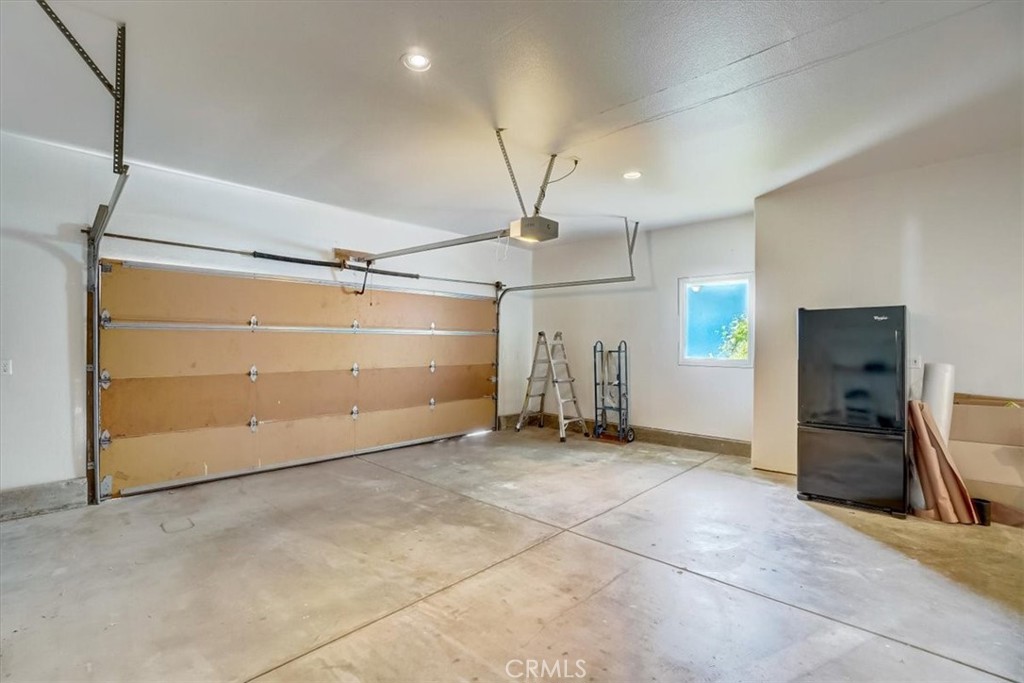 95 Hiller Drive Oakland, CA 94618 - Photo 23 of 58 a view of a room with gym equipment and a window