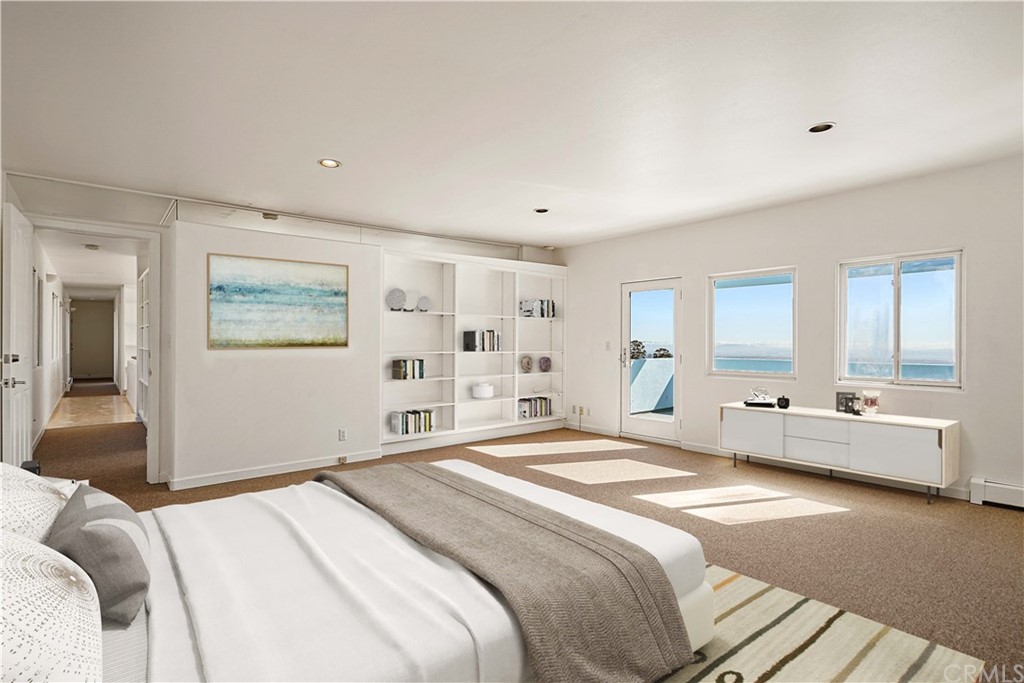 95 Hiller Drive Oakland, CA 94618 - Photo 44 of 58 a spacious bedroom with a large bed and a large window