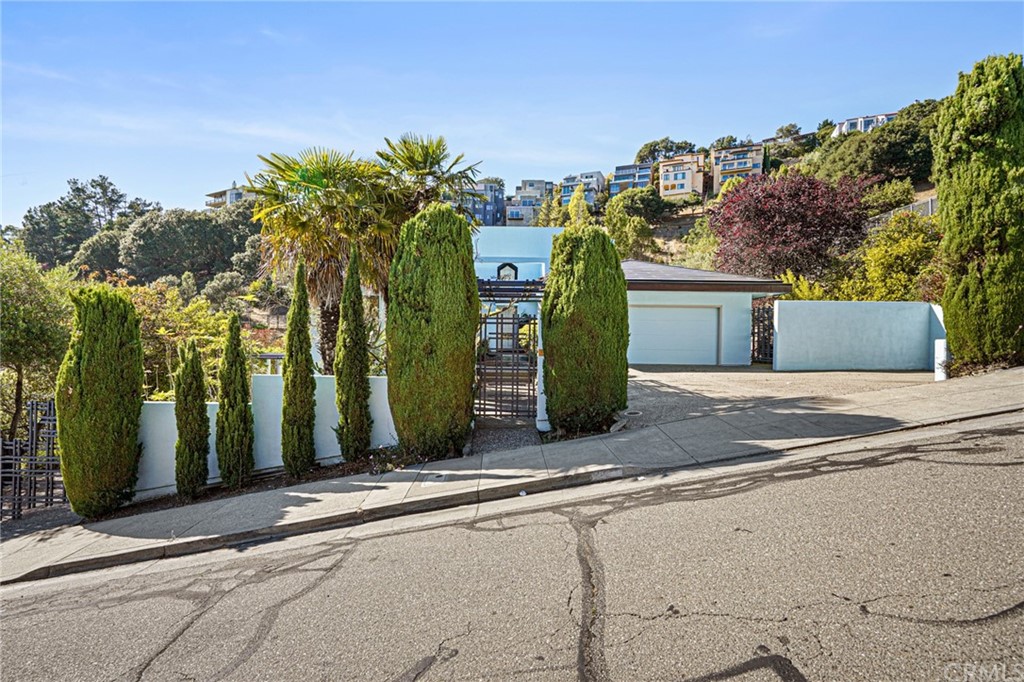 95 Hiller Drive Oakland, CA 94618 - Photo 7 of 58 a front view of a house with a yard