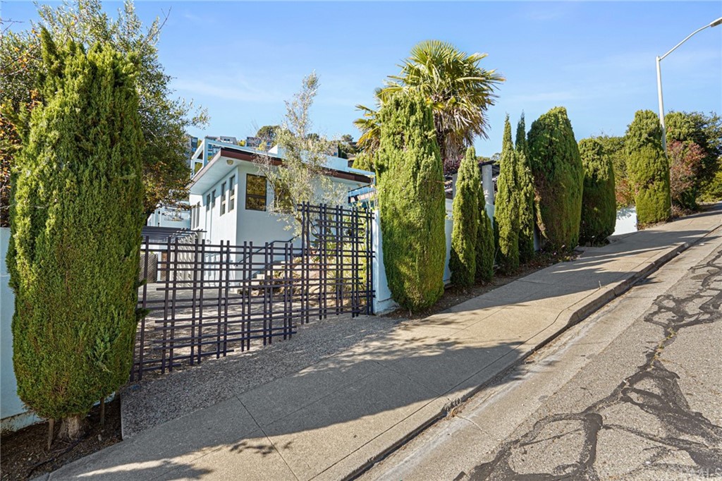 95 Hiller Drive Oakland, CA 94618 - Photo 8 of 58 a view of a house with a garden