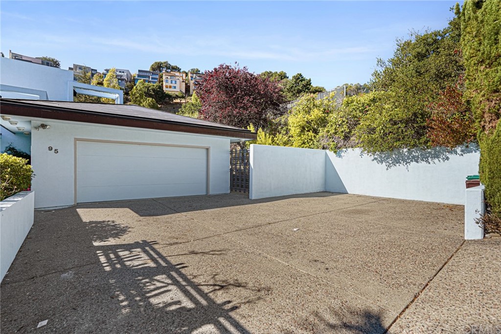 95 Hiller Drive Oakland, CA 94618 - Photo 9 of 58 2 car garage and carport. Carport will fit several cars in addition to the garage
