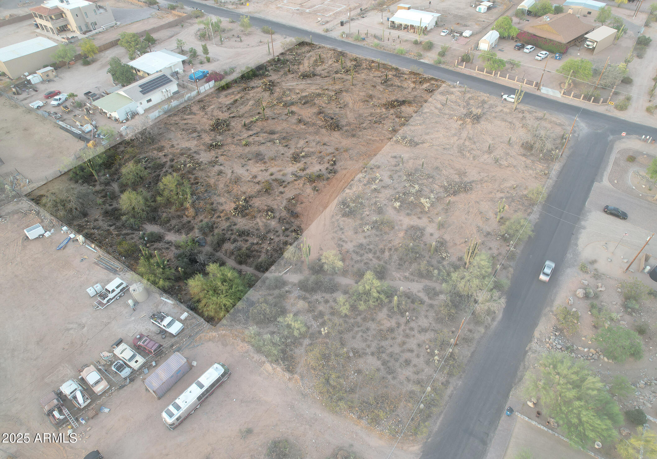 0 North Delaware Drive Apache Junction, AZ 85120 - Photo 10 of 18 a view of a dry yard with wooden fence