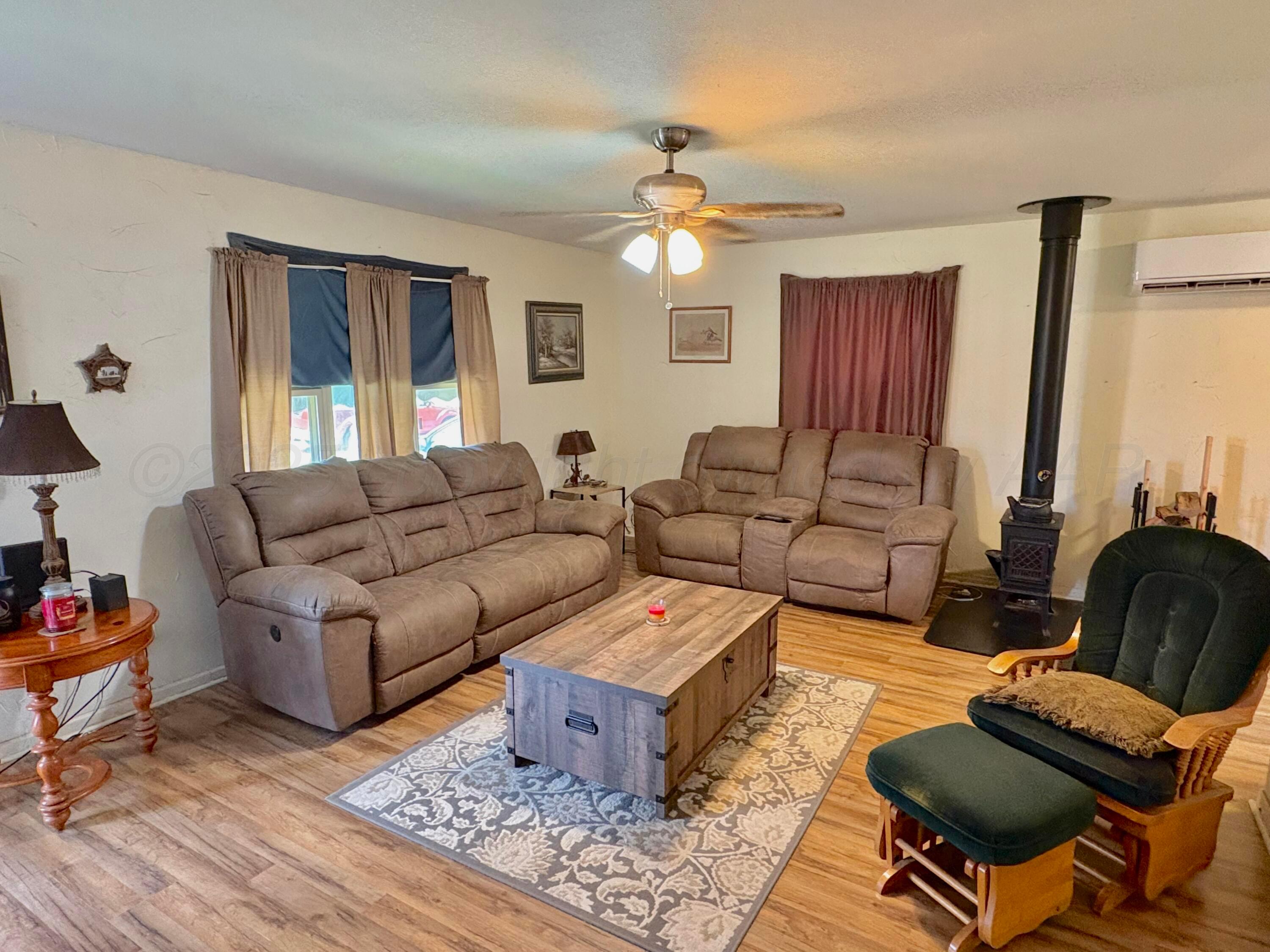 4405 South Lipscomb Street Amarillo, TX 79110 - Photo 3 of 9 a living room with furniture and a large window