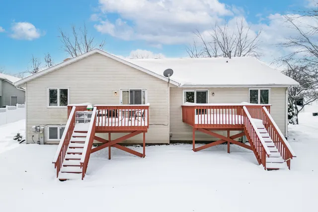 a balcony with a couch and chairs