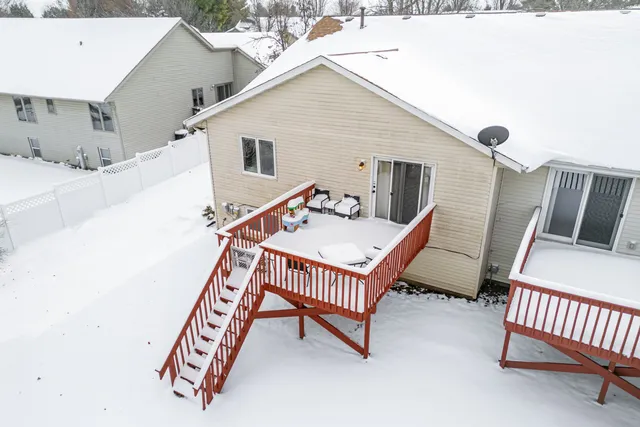 a balcony with table and chairs