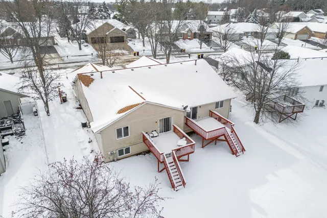 an aerial view of a house with backyard space