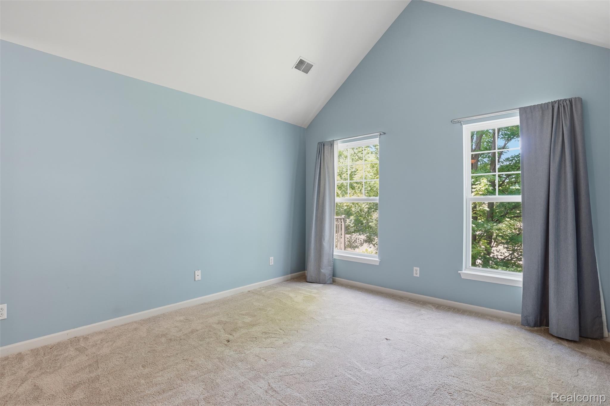 320 North Wixom Road, Unit 30 Wixom, MI 48393 - Photo 19 of 28 Primary bedroom with cathedral ceiling
