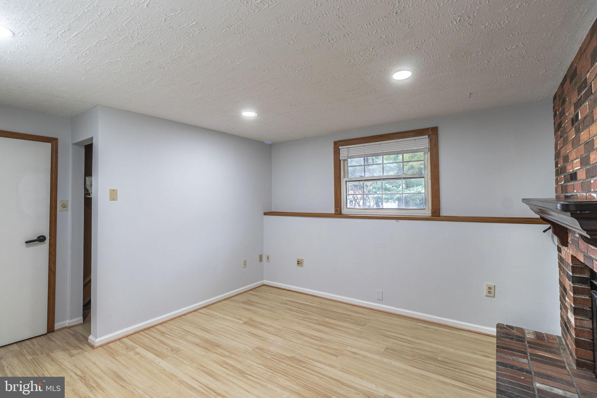 8764 Cold Plain Court Springfield, VA 22153 - Photo 19 of 24 an empty room with wooden floor and windows