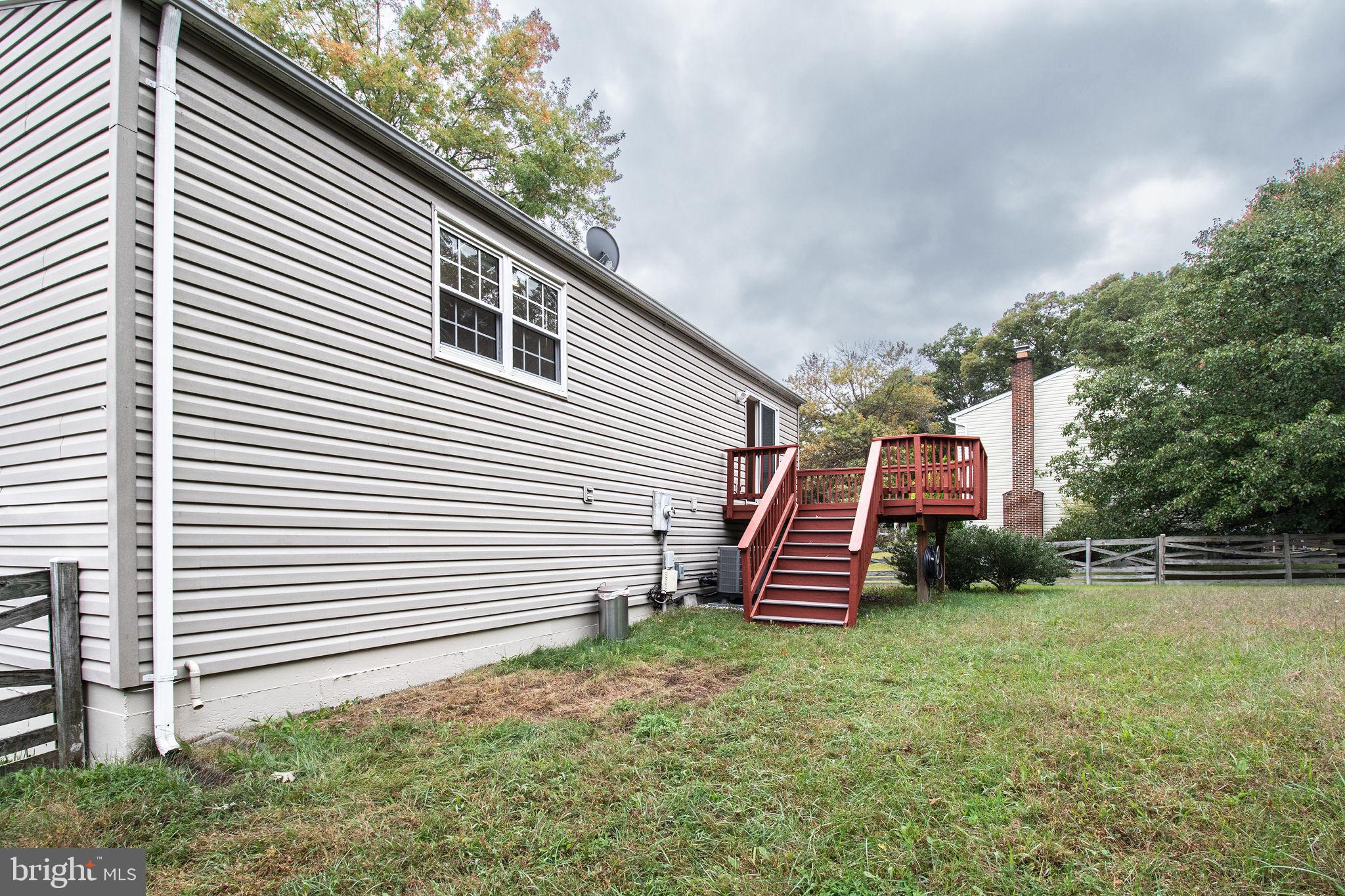 8764 Cold Plain Court Springfield, VA 22153 - Photo 22 of 24 a front view of a house with a yard