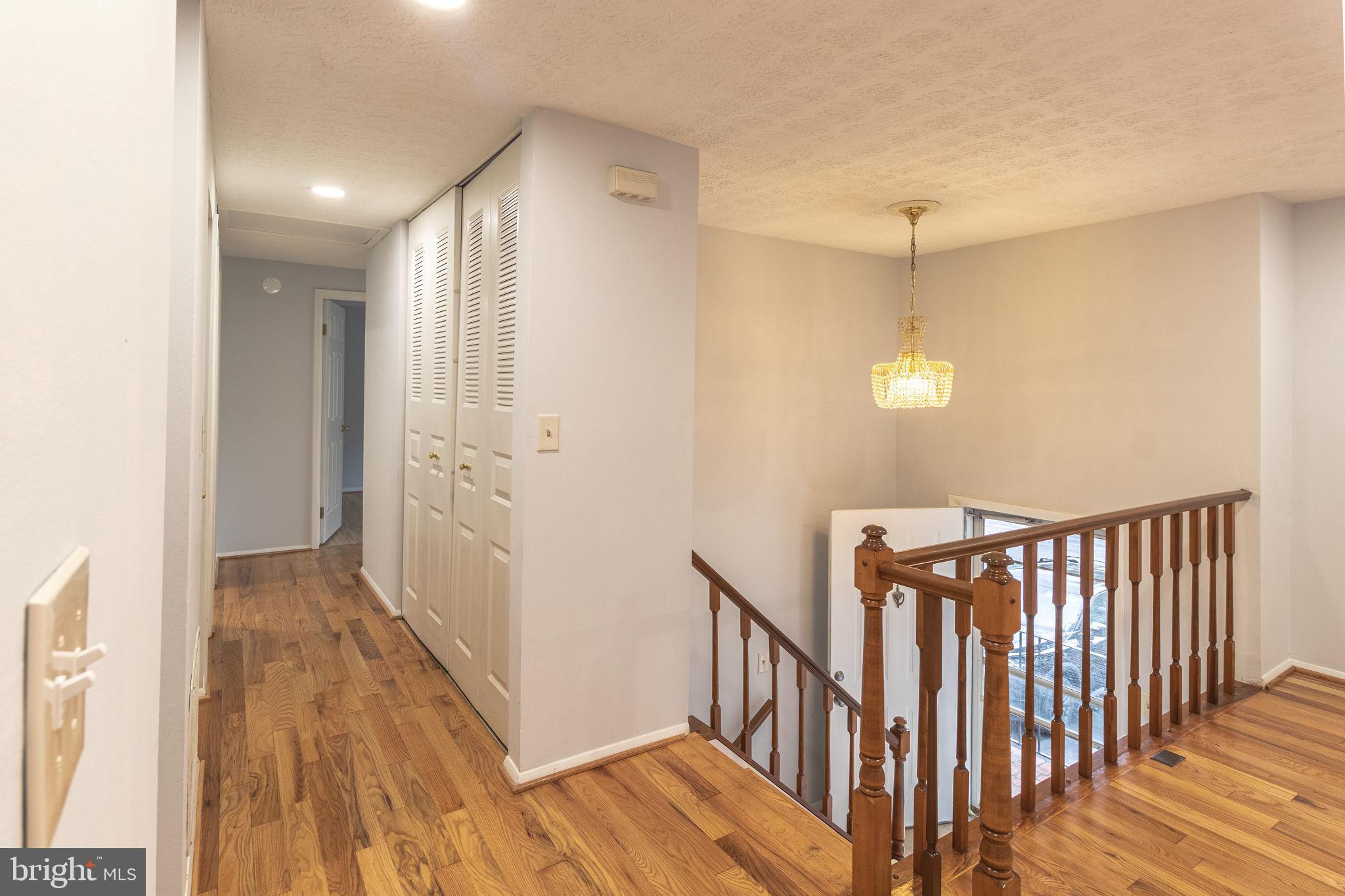 8764 Cold Plain Court Springfield, VA 22153 - Photo 4 of 24 a view of hallway with wooden floor