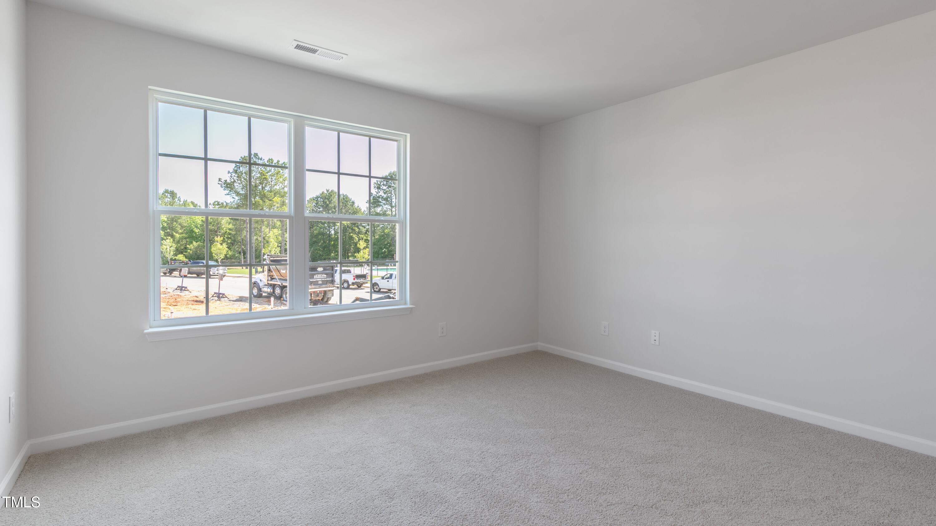 55 Virgo Drive Angier, NC 27501 - Photo 16 of 31 an empty room with a window