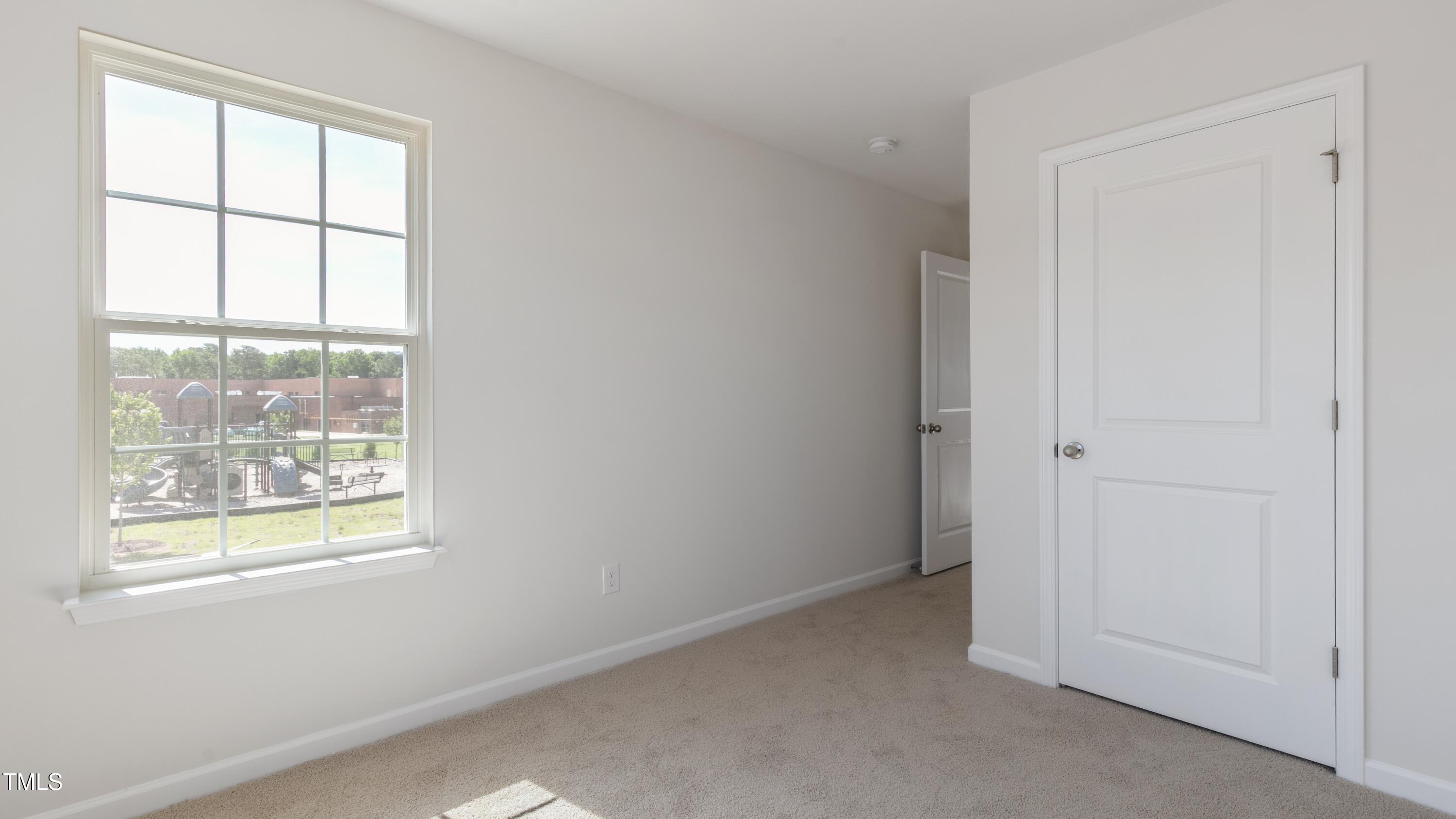 55 Virgo Drive Angier, NC 27501 - Photo 22 of 31 an empty room with windows