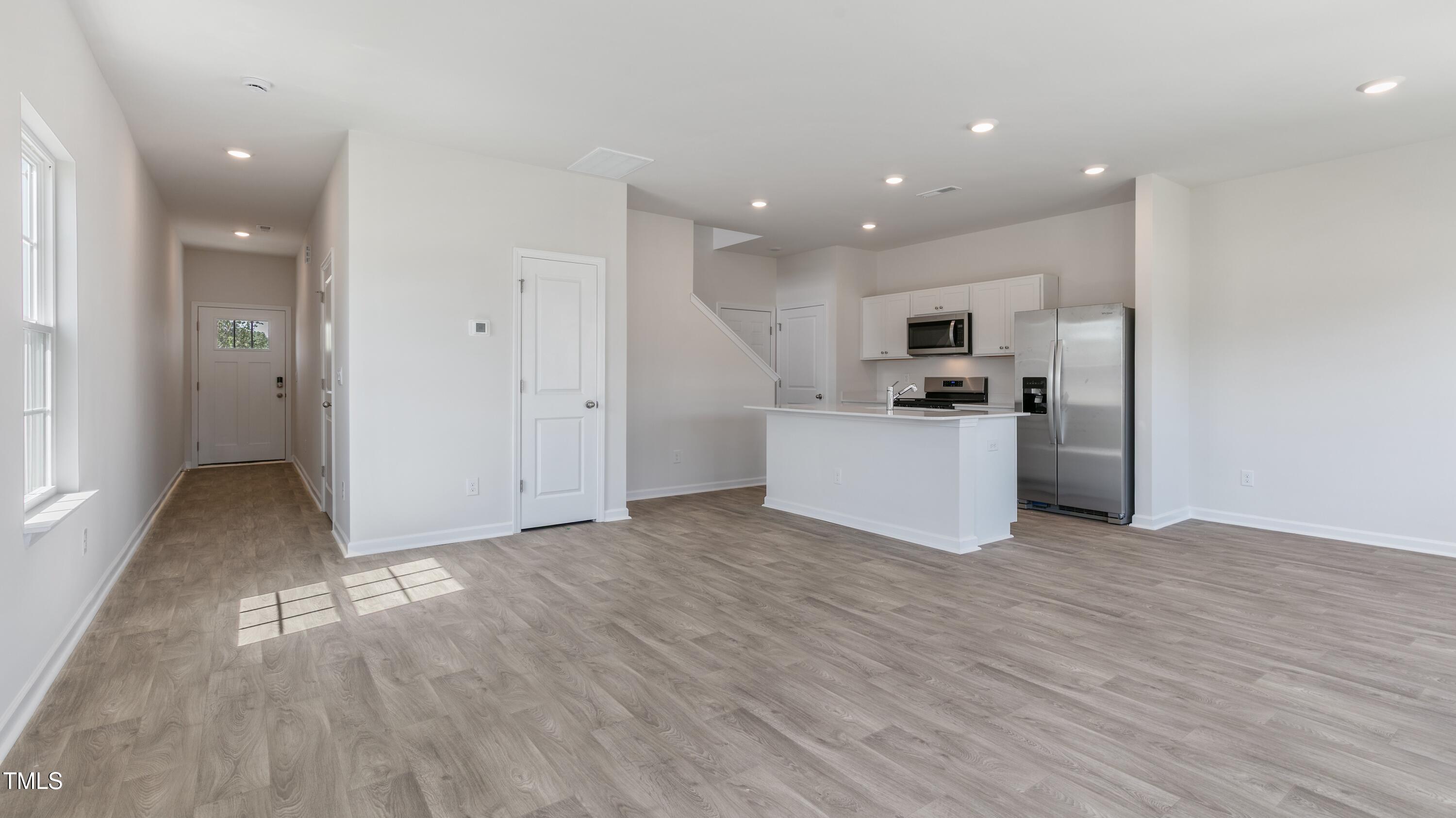 55 Virgo Drive Angier, NC 27501 - Photo 3 of 31 a view of a kitchen with a sink and a refrigerator