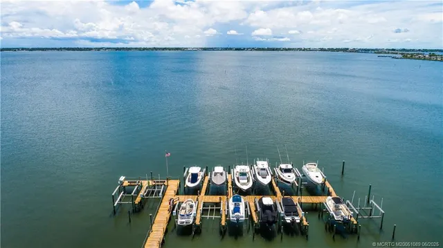 an aerial view of a house with a lake view