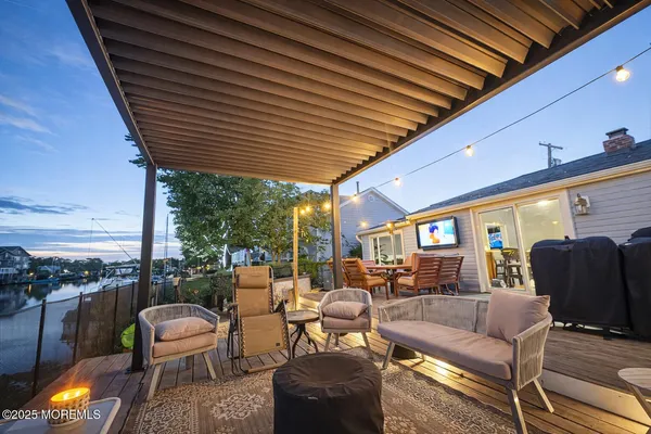 a outdoor living space with furniture and city view