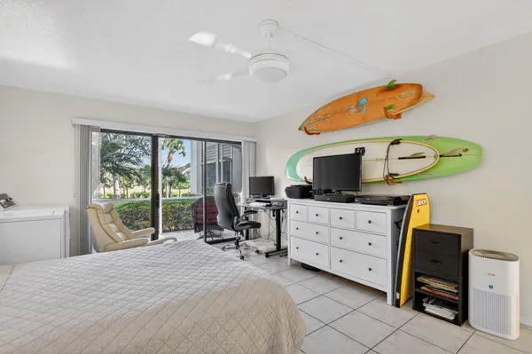 a bedroom with a bed and a television