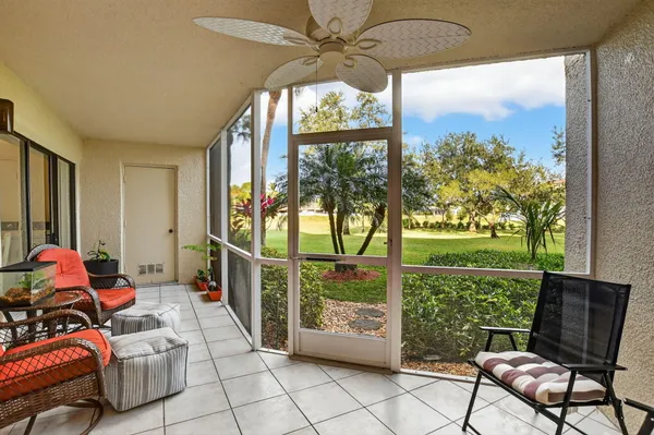 a room with furniture and garden view
