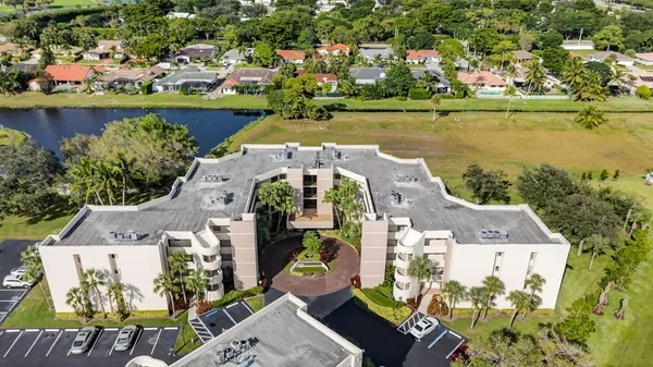 an aerial view of a house with a lake view
