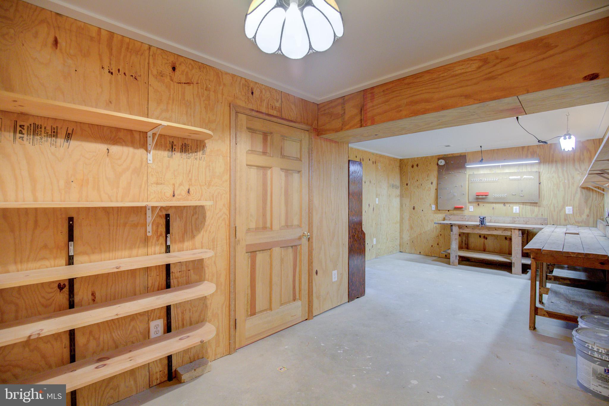 813 Blacks Hill Road Great Falls, VA 22066 - Photo 69 of 92 Spacious Work Room w/ Workbench & Shelving