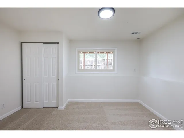 a bathroom with a sink mirror vanity and toilet