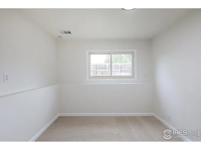 a view of a house with backyard and chairs