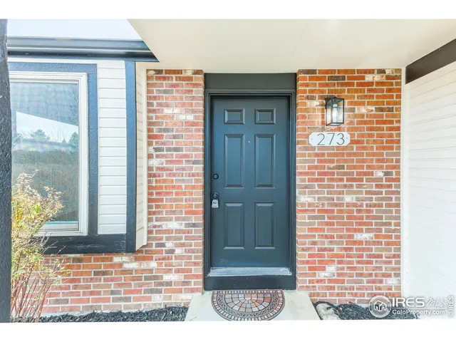 a view of a door and a window