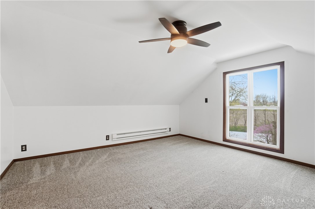 7553 Coffin Station Road Springfield, OH 45502 - Photo 66 of 95 This bright and airy room offers sloped ceilings, soft carpeting, and a view of the outdoors.