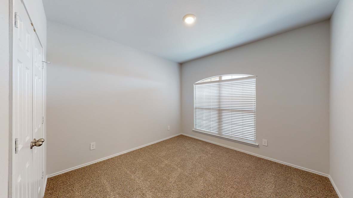 401 Creekfall Road Burnet, TX 78611 - Photo 17 of 23 an empty room with windows