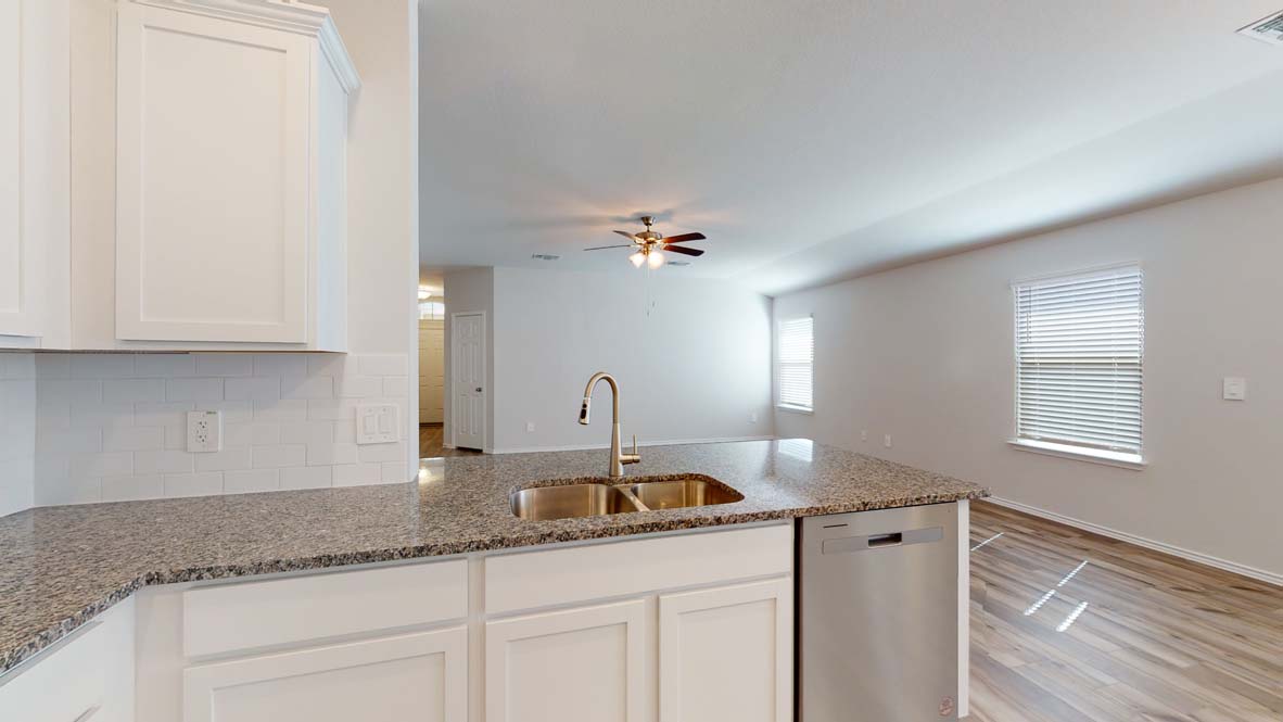 401 Creekfall Road Burnet, TX 78611 - Photo 5 of 23 a kitchen with a sink and cabinets