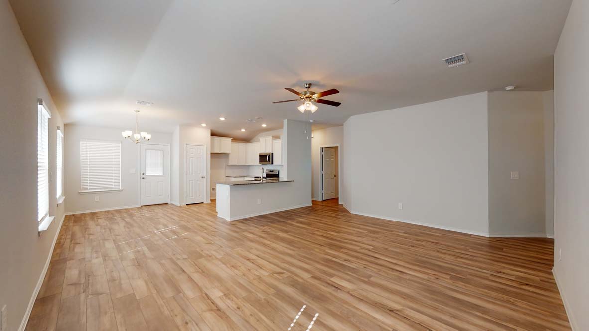 401 Creekfall Road Burnet, TX 78611 - Photo 8 of 23 a view of a kitchen with a sink and a refrigerator