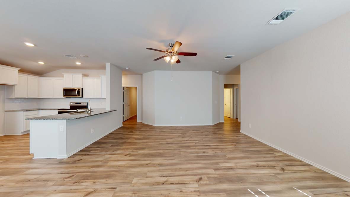 401 Creekfall Road Burnet, TX 78611 - Photo 22 of 23 a view of kitchen with sink microwave and stove top oven