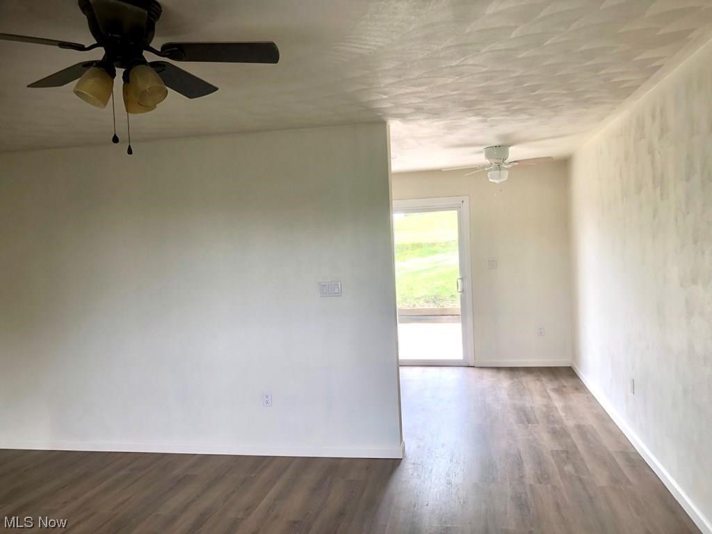 756 Northview Road Wellsburg, WV 26070 - Photo 5 of 25 Unfurnished room featuring ceiling fan and light hardwood flooring