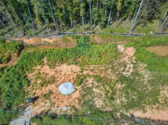 a backyard of a house with a yard and outdoor seating