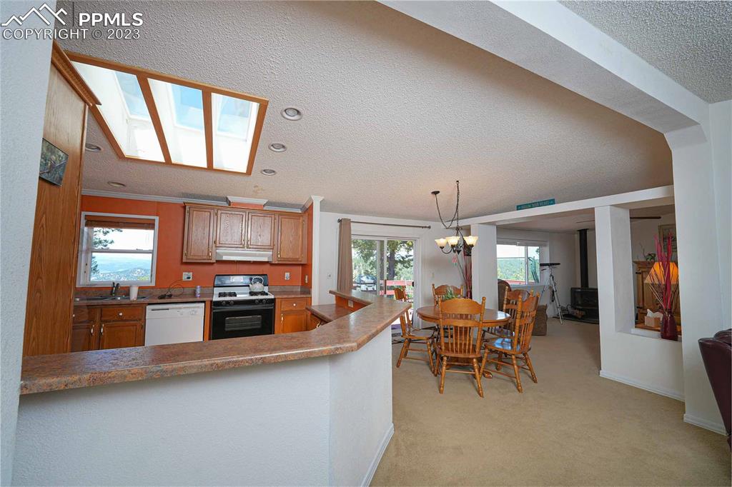 187 Blue Spruce Road Divide, CO 80814 - Photo 6 of 31 a view of a dining room with furniture window and outside view