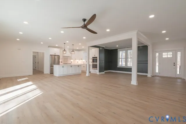 a view of a kitchen with a sink and a window