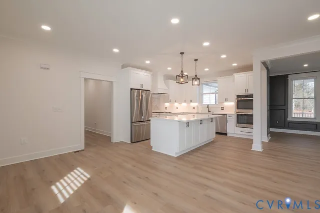 a view of kitchen with wooden floor