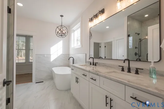 a bathroom with a sink double vanity and a mirror