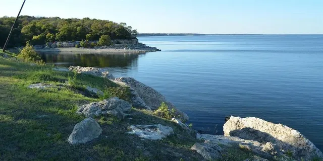 a swimming pool view with a lake view