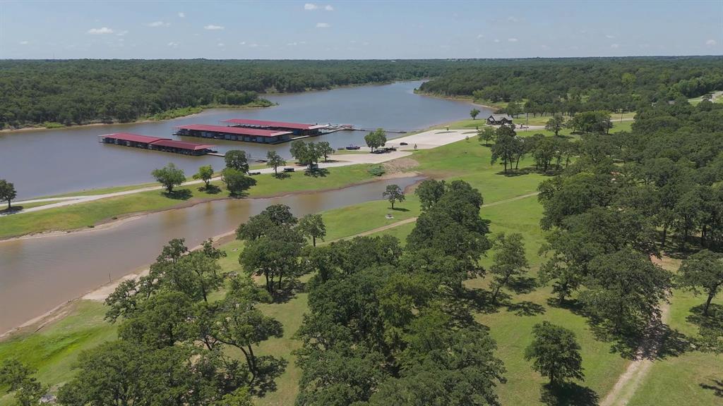 60 Timber Bank Drive Gordonville, TX 76245 - Photo 16 of 24 an aerial view of residential houses with outdoor space and lake view