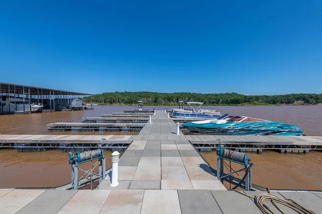 an aerial view of a house with swimming pool patio and outdoor seating