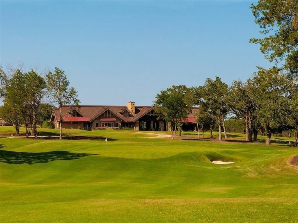 60 Timber Bank Drive Gordonville, TX 76245 - Photo 23 of 24 a view of a swimming pool with a big yard and a large trees