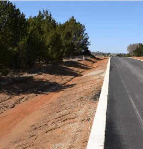 a view of a yard with trees