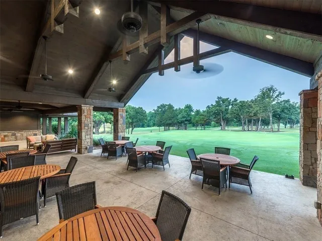 an outdoor space with furniture and garden