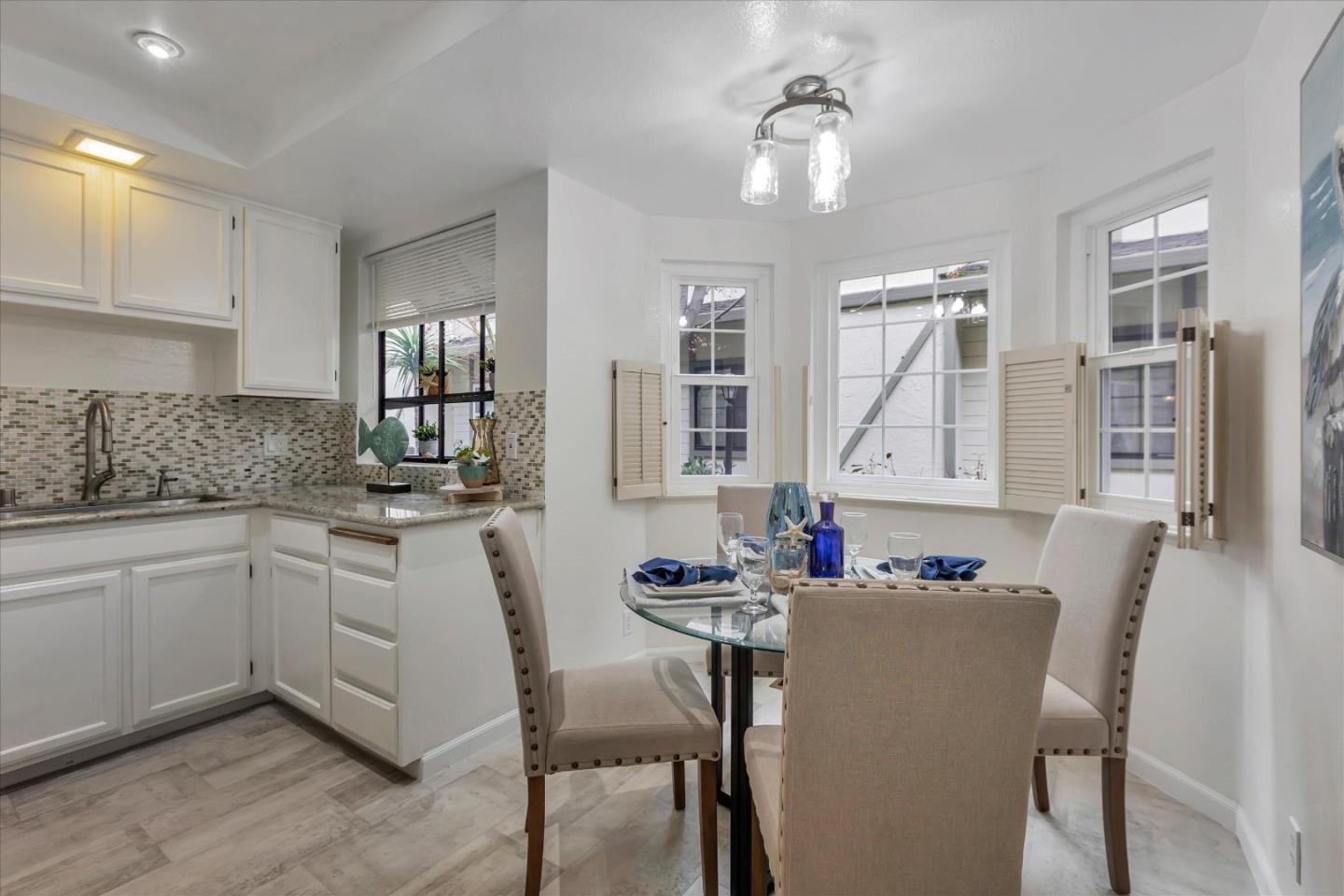 38 Devonshire Avenue, Unit 2 Mountain View, CA 94043 - Photo 12 of 38 a kitchen with sink dining table and chairs
