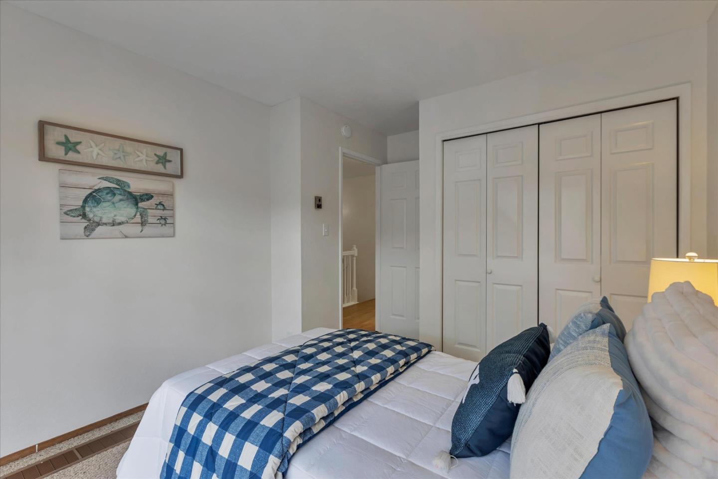 38 Devonshire Avenue, Unit 2 Mountain View, CA 94043 - Photo 17 of 38 a bedroom with a bed and painting on the wall